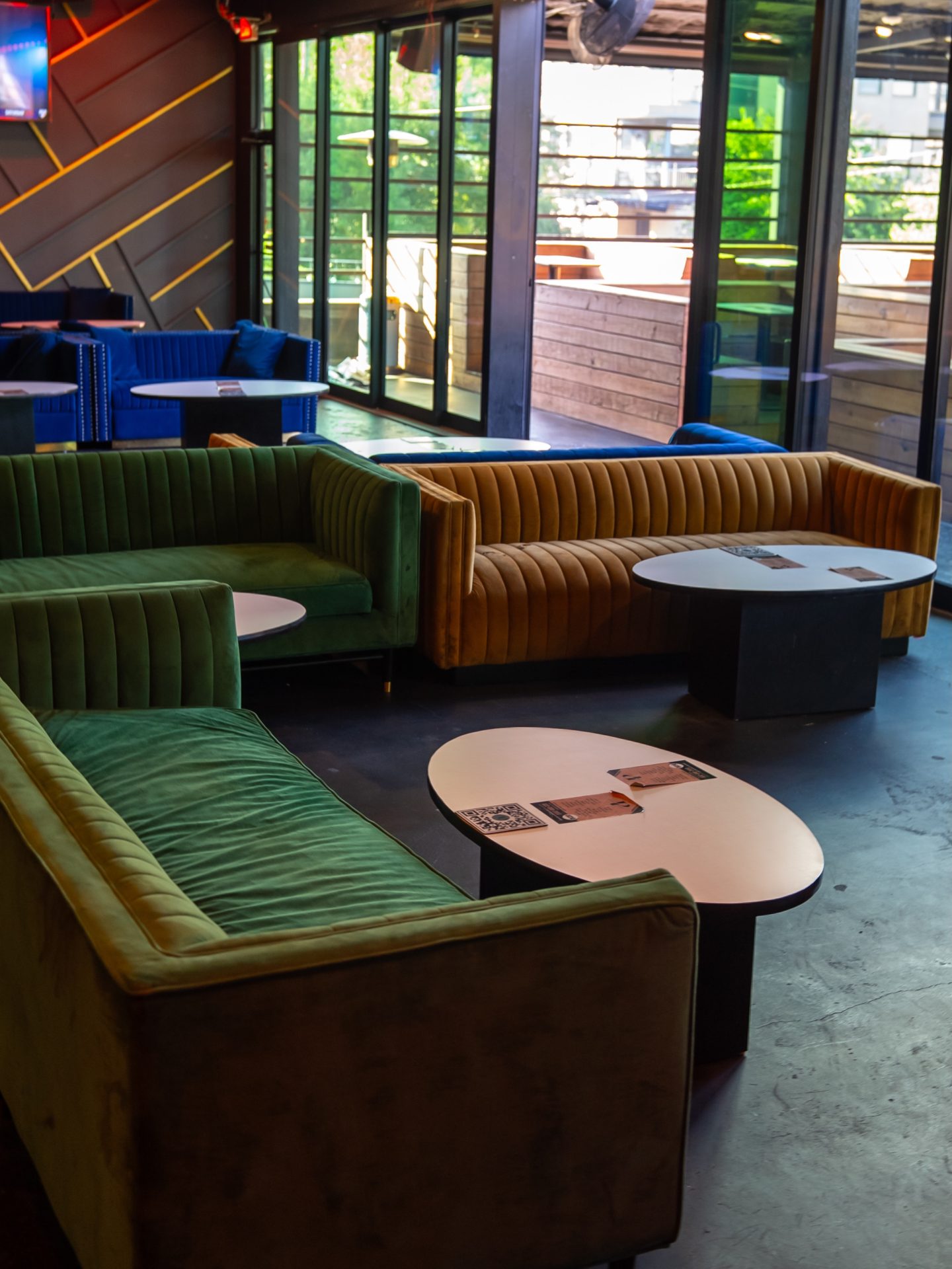 Velvet lounge seating inside Privilege Houston