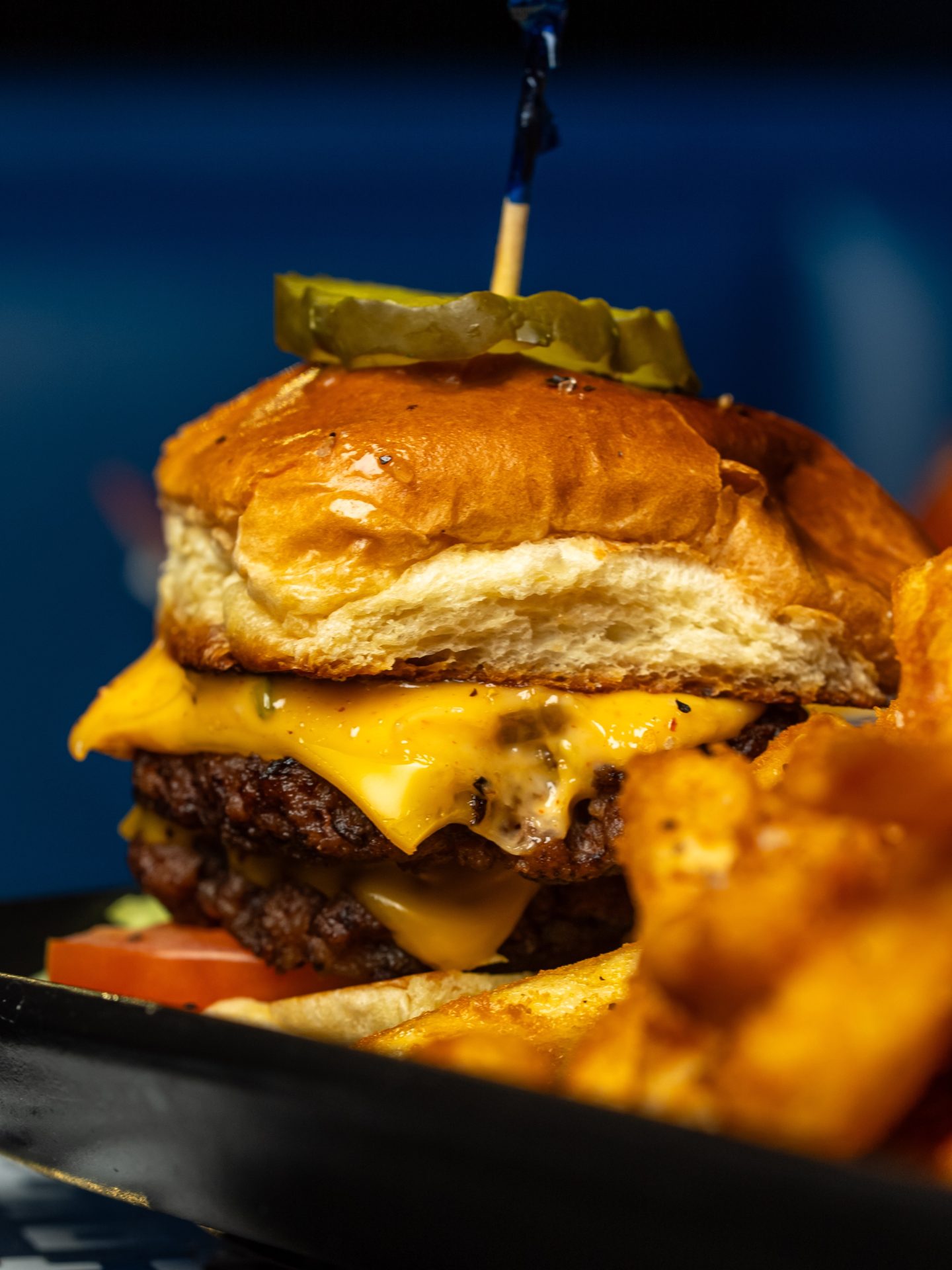 Double smash slider with melted cheese and pickles from the Privilege kitchen